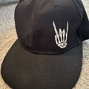 All black NWOT black skater hat with skull fingers rock on